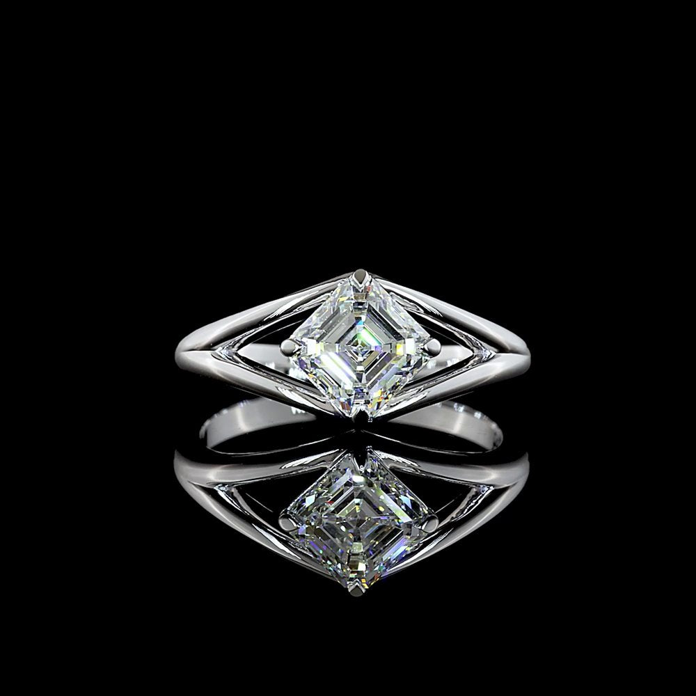 An Asscher-cut diamond set on point in a split-shank platinum ring