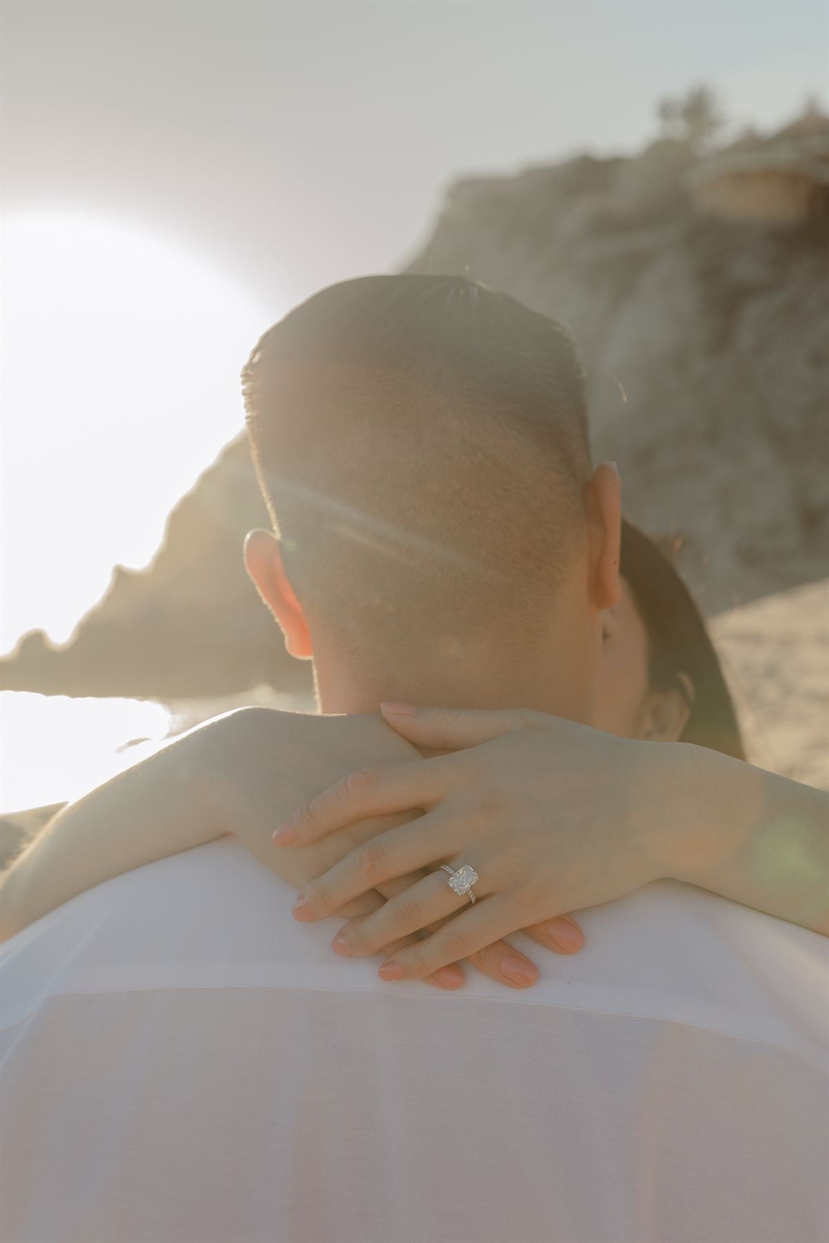 A couple embracing in golden evening light